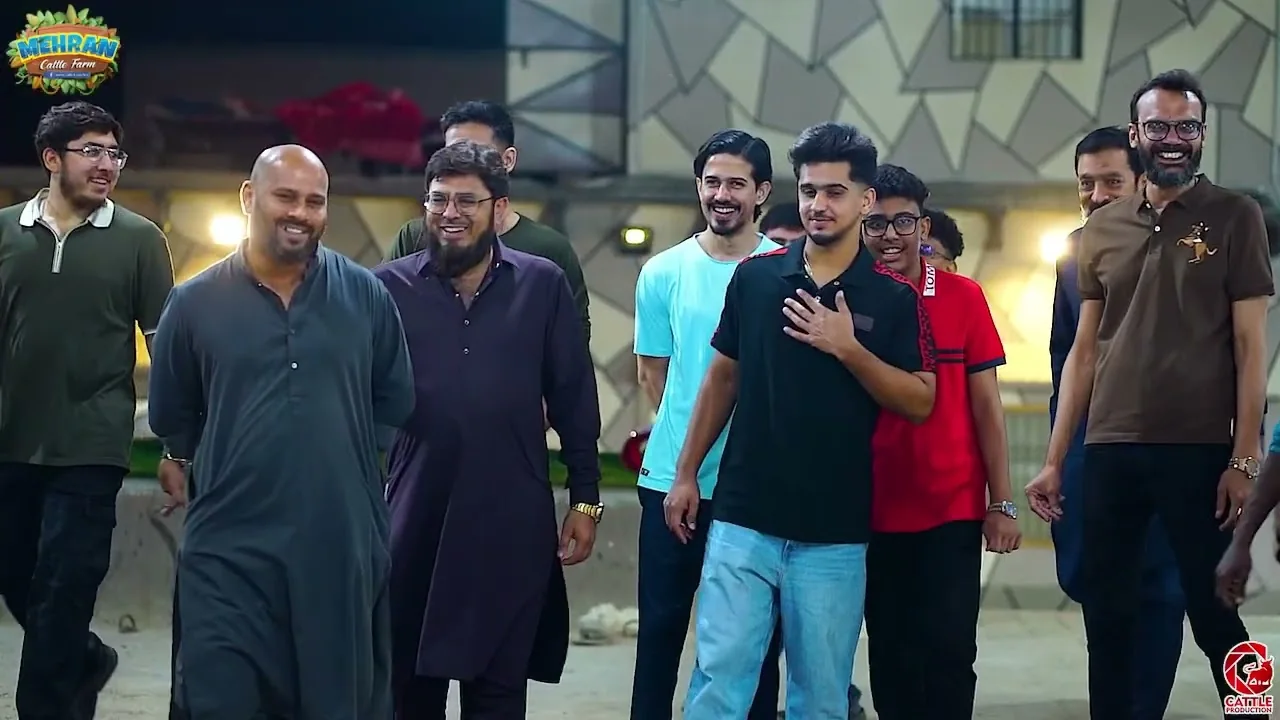 Saim Ayub walking through the farm with the team
